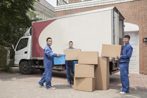 Removal van and moving crew in Clapham residential street