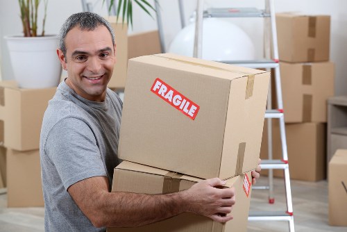 Furniture removal team planning a move in a Clapham street