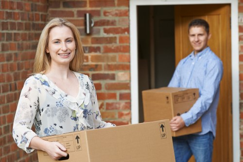 House removalists loading furniture in a Clapham street