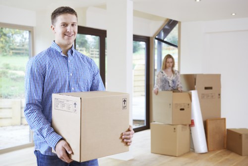 Local packing team preparing fragile household items for a move in Clapham