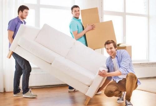 Removal team in Clapham preparing belongings with safety equipment
