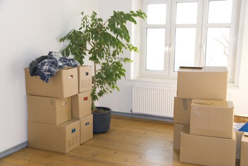 Professional movers loading business equipment in Clapham