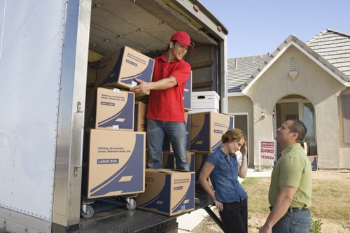 Professional movers handling household items carefully