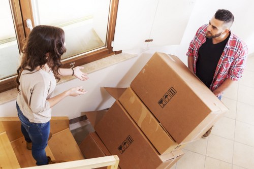 Packed moving boxes and furniture protection for a Clapham home move
