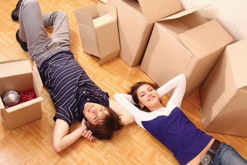 Packed boxes and furniture ready for flat removals in Clapham